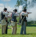 Men Firing Guns Together