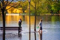 Men fish with nets in the flooded Park in Ottawa