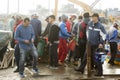 Men fishermen, carrying boxes with fish and equipment, Essaouira, Morocco