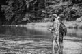 Men fishing. Fisherman family at river. Rod tackle. Fishing equipment. Hobby sport. Fishing with spinning reel. Fishing Royalty Free Stock Photo