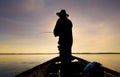 Men are fishing in the marsh.