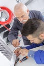 man fixing radiator Royalty Free Stock Photo