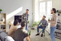 Men friends with beard at home talking and laughing with a beer. The concept of friendship. Royalty Free Stock Photo