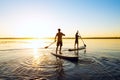 Men, friends are paddling on a SUP boards Royalty Free Stock Photo