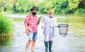Men friends relaxing river background. Personal instructor. Bearded man elegant businessman fish together. Learn to fish