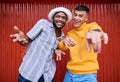 Men, gen z or portrait of friends outdoor on red background in streetwear with fashion or style together. Diversity