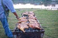 Men are grilling, grilled chicken on the stove, cooked with bright colors, appetizing, popular food in Thailand.