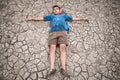 Men on ground cracked dry due to drought. Royalty Free Stock Photo