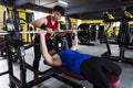 Men in the gym and the guidance of the coach. Royalty Free Stock Photo
