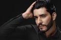 Men Hair Beauty. Handsome Male Model Touching Healthy Hair Royalty Free Stock Photo