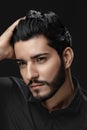 Men Hair Beauty. Handsome Male Model Touching Healthy Hair Royalty Free Stock Photo