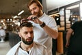 Men Hair Salon. Man Barber Doing Hairstyle In Barbershop Royalty Free Stock Photo