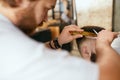 Men Haircut. Barber Cutting Man`s Hair In Barber Shop