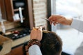 Men Haircut. Barber Cutting Man`s Hair In Barber Shop