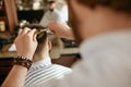 Men Haircut. Barber Cutting Man`s Hair In Barber Shop