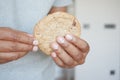 men hand breaking sweet cookies