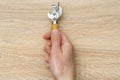 Men hand holds old can opener Royalty Free Stock Photo