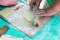 Men hands rolls dough closeup outdoors, cook on camp. Concept of homemade cooking