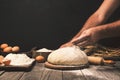 Men hands sprinkle dough flour close up