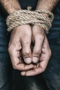 Men hands are tied with a rope. The concept of imprisonment in modern society Royalty Free Stock Photo