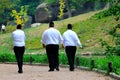 3 men, Hasidic Jews walk in the park in Uman. Ukraine, Jewish New Year, religious Jew