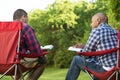 Multi-Ethnic group of friends talking and having a bible study. Royalty Free Stock Photo