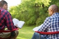 Multi-Ethnic group of friends talking and having a bible study. Royalty Free Stock Photo