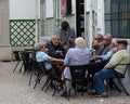 Men Outside A Small Cafe In Faro Portugal
