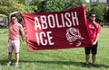 Men Hold Up Abolish Ice Banner at Immigration Rally