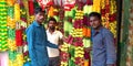 men holded flowers chain hanging at decorations item store in india aug 2019