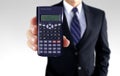 Men holding calculator showing investment strategy