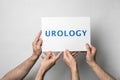 Men holding card with word UROLOGY Royalty Free Stock Photo