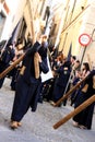 Men holding crucifix, Easter procession in Jerez