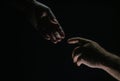 Men holding hands isolated on black. Connection and human relations. Male hands rescue. Friendly handshake, friends Royalty Free Stock Photo