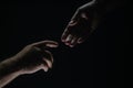 Men holding hands isolated on black. Connection and human relations. Male hands rescue. Friendly handshake, friends Royalty Free Stock Photo