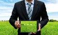 Men holding touch screen tablet technology planting Royalty Free Stock Photo