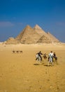 Men on horses at the Pyramids Giza