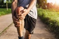 Men injured from exercise Use your hands to hold your knees at the park Royalty Free Stock Photo