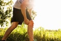 Men injured from exercise Use your hands to hold your knees at the park Royalty Free Stock Photo