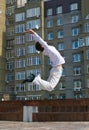 Men jumping against urban landscap Royalty Free Stock Photo