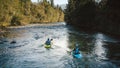 Men in kayaks, paddling over a mountain river, aerial shot