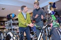 Men looking at golfing equipment in sports shop Royalty Free Stock Photo