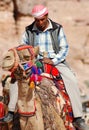 Men looks for tourists for camel ride.