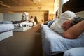 Men Lying On Beds In Homeless Shelter Royalty Free Stock Photo