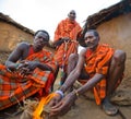 Men Masai tribe make a fire in the traditional way. Royalty Free Stock Photo