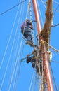 Men on masts Royalty Free Stock Photo