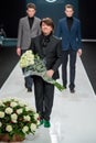 The men model at the fashion show Valentin Yudashkin in Moscow Fashion Week, Fall-Winter 2016/2017 Royalty Free Stock Photo