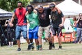 Men Move Together In Five-Legged Race