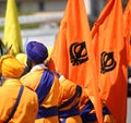 Men with orange flags and sikh symbol called KHANDA during celeb