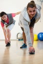 Men performing stretching exercise Royalty Free Stock Photo